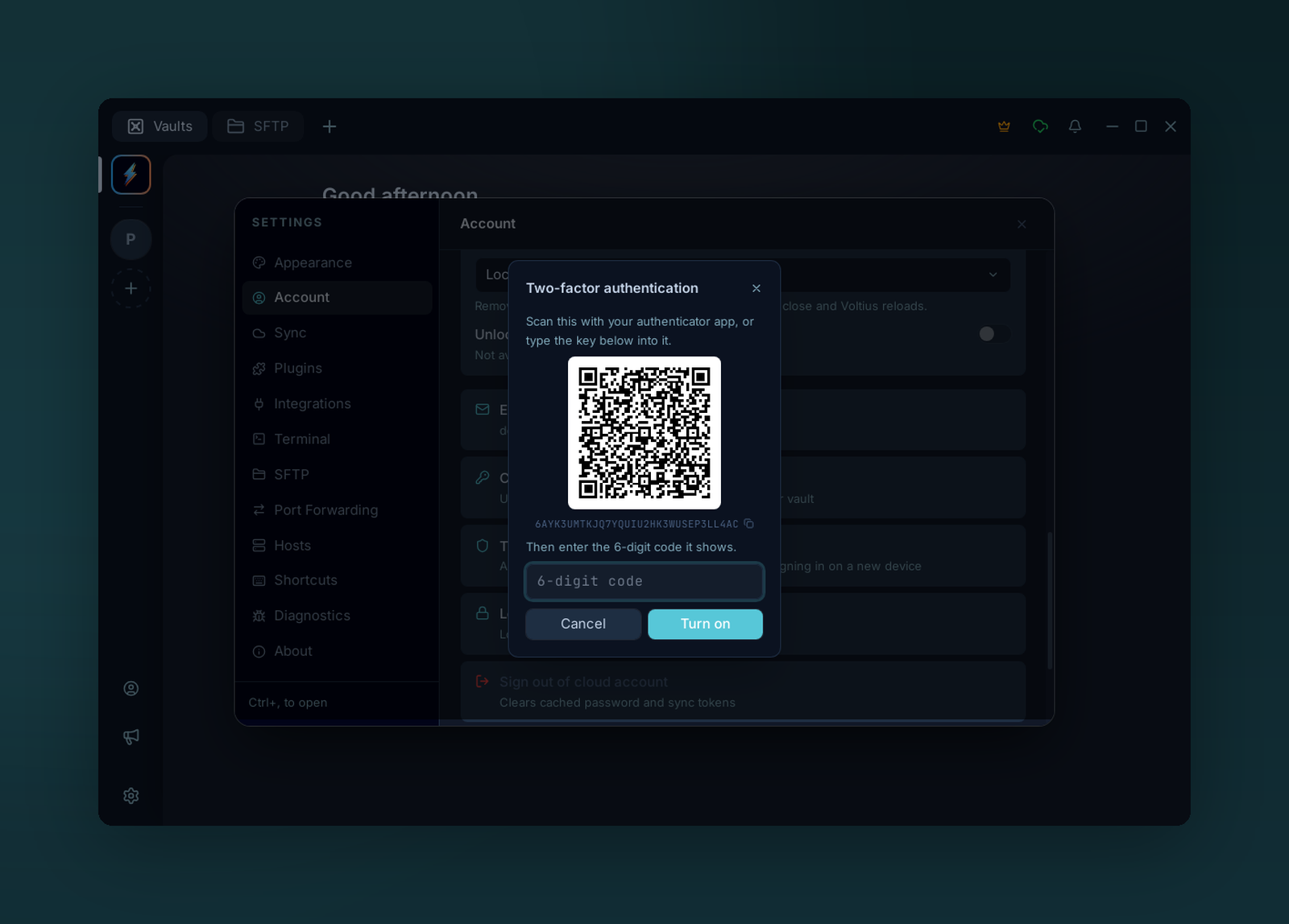 The two-factor setup dialog in Settings, showing a QR code, the key as text and a field for the first code